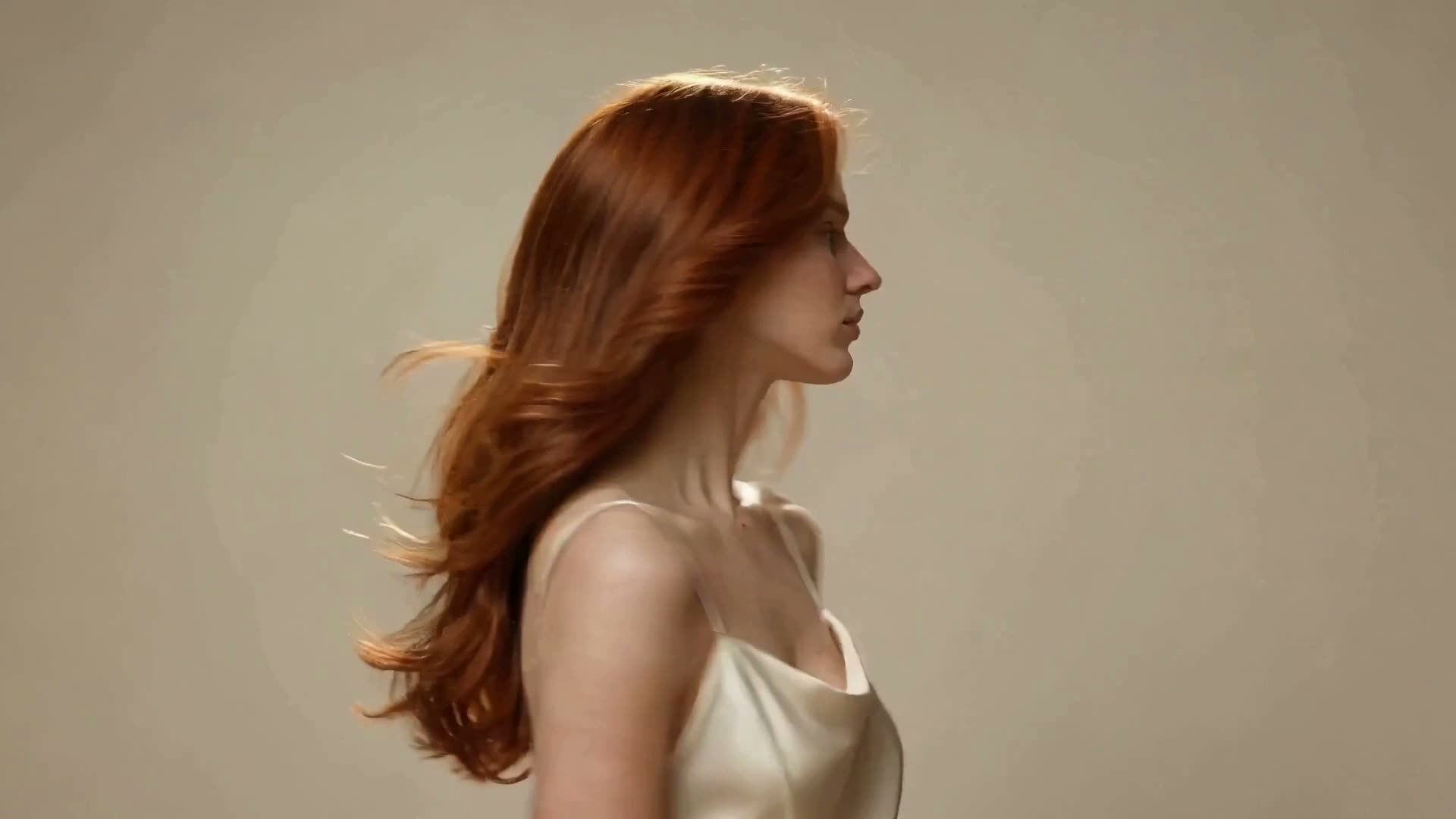 Blush-toned crop of flowing auburn hair — Mara’s profile image